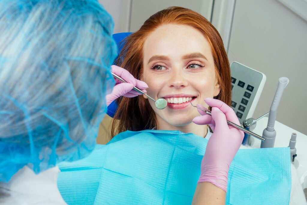 Dental drilling procedure and check up on beautiful teeth and open mouth